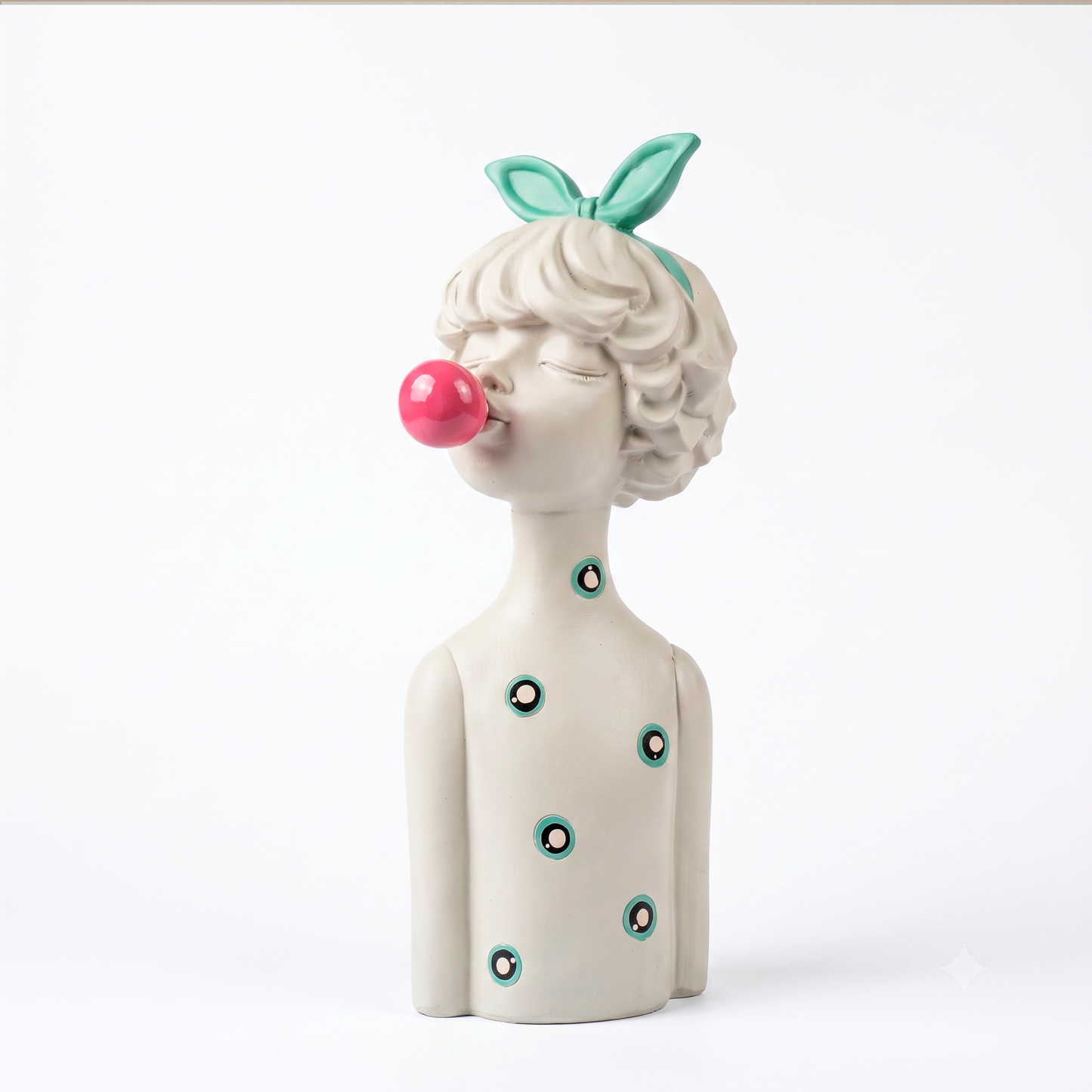 Figura decorativa niña con lazo y globo, vista frontal en resina blanca con círculos turquesa, fondo blanco